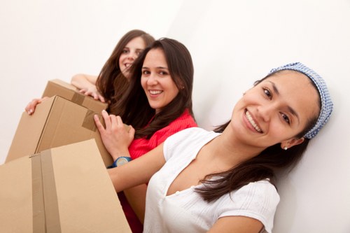 Careful wrapping of fragile household items during a Southwark packing service
